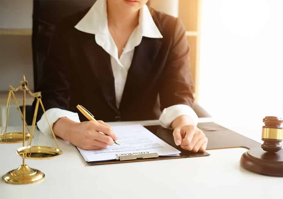 Female Lawyer Signing Documents — Oceanside Services In Grafton, NSW